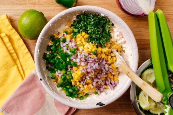 adding corn to street corn dip | www.iamafoodblog.com